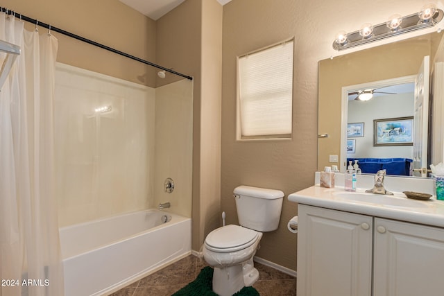 full bathroom with vanity, tile patterned floors, ceiling fan, toilet, and shower / tub combo