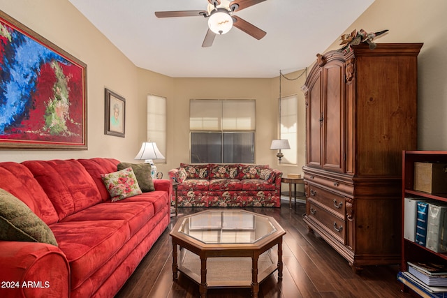 living room featuring ceiling fan, a healthy amount of sunlight, and dark hardwood / wood-style floors