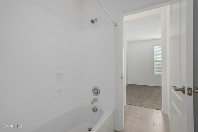 bathroom with tile patterned flooring and tub / shower combination