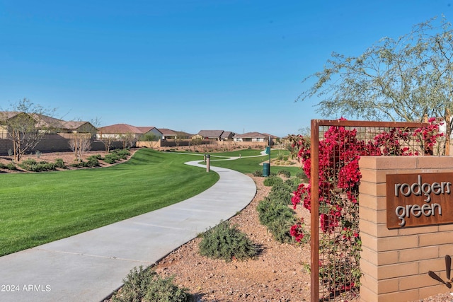 view of property's community featuring a yard