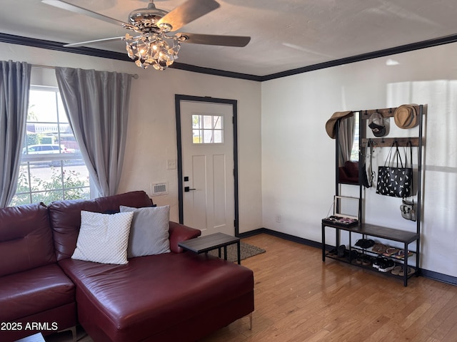 1222 E Almeria Rd, Phoenix, AZ 85006 - living area featuring ceiling fan, hardwood / wood-style flooring, baseboards, and crown molding
