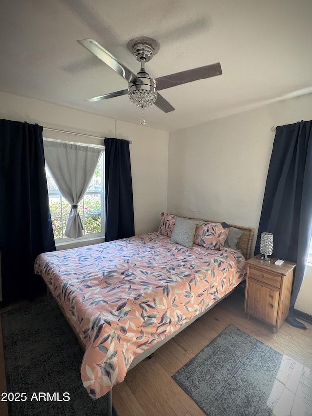 1222 E Almeria Rd, Phoenix, AZ 85006 - bedroom with wood finished floors and a ceiling fan