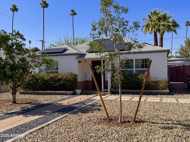 1222 E Almeria Rd, Phoenix, AZ 85006 - view of front of property with solar panels, a shingled roof, and brick siding