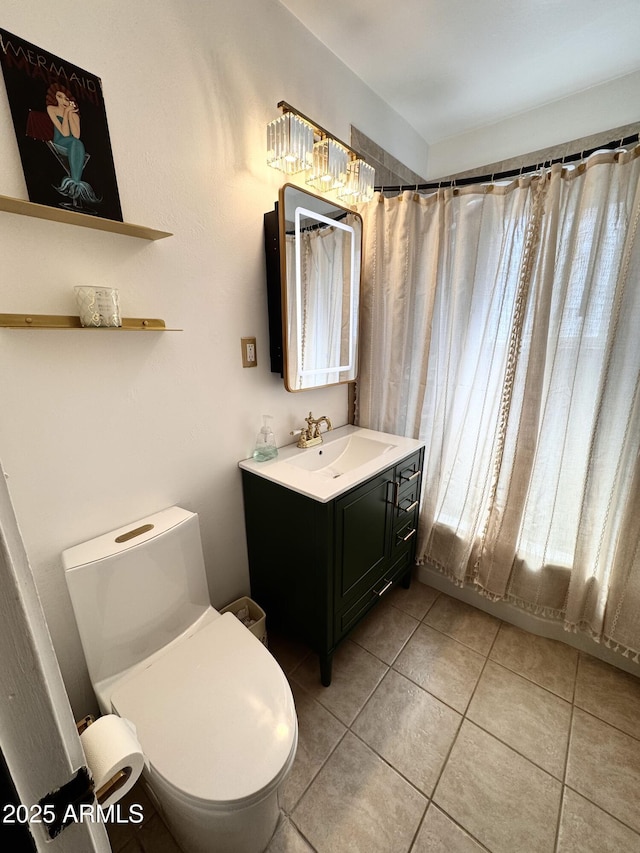 1222 E Almeria Rd, Phoenix, AZ 85006 - full bath with tile patterned flooring, toilet, vanity, and a shower with shower curtain