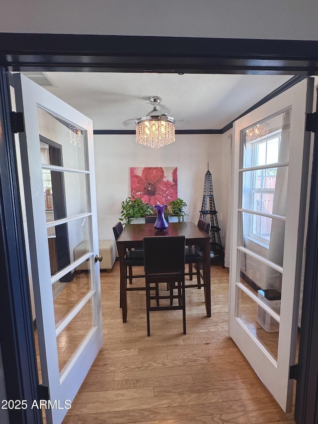 1222 E Almeria Rd, Phoenix, AZ 85006 - dining room with a chandelier, wood finished floors, and ornamental molding