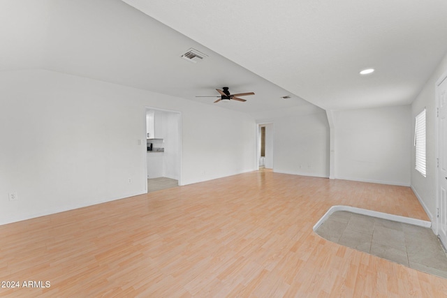 spare room featuring light hardwood / wood-style floors and ceiling fan