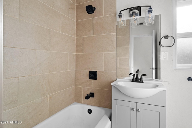 bathroom featuring vanity and tiled shower / bath combo