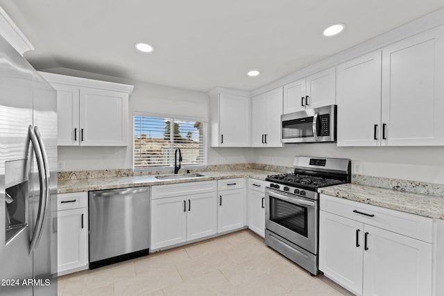 kitchen with white cabinetry, sink, and appliances with stainless steel finishes