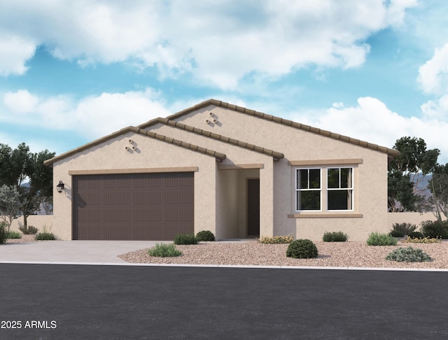 view of front facade featuring a garage, driveway, and stucco siding