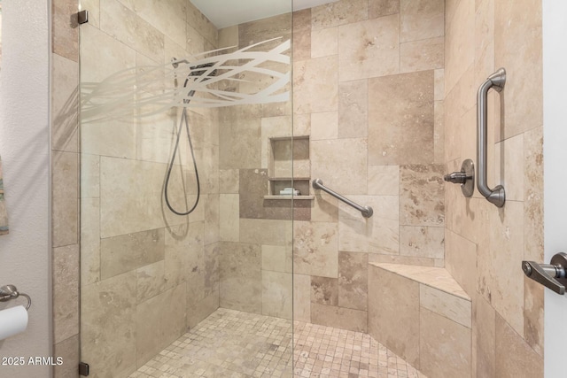 bathroom with a tile shower