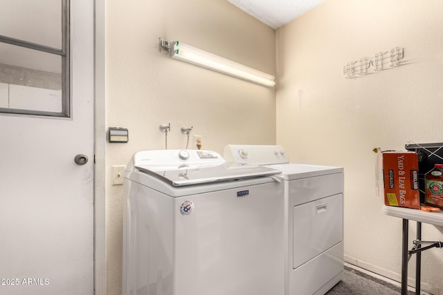 laundry area with washing machine and clothes dryer