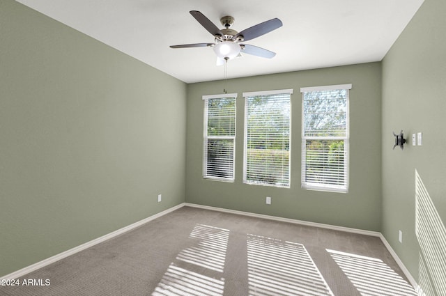 731 E Verde Blvd, Queen Creek, AZ 85140 - spare room with ceiling fan, carpet floors, and baseboards