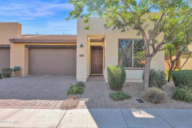731 E Verde Blvd, Queen Creek, AZ 85140 - view of front facade featuring stucco siding, a garage, and driveway