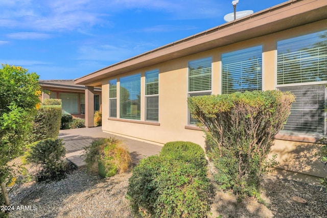 731 E Verde Blvd, Queen Creek, AZ 85140 - view of side of property featuring stucco siding and a patio