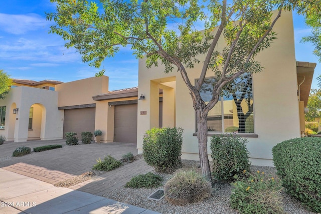 731 E Verde Blvd, Queen Creek, AZ 85140 - view of front of house featuring an attached garage, stucco siding, decorative driveway, and a tile roof