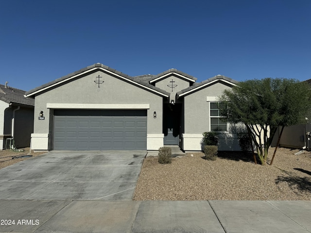 ranch-style home featuring a garage