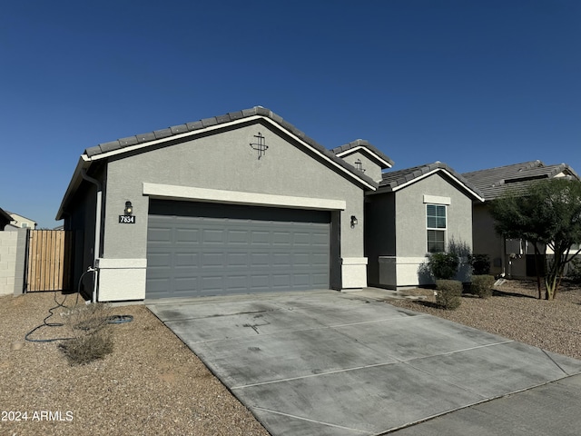 ranch-style home with a garage