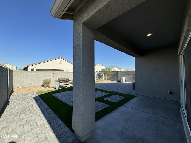 view of patio with a grill