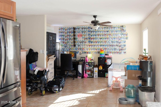 home office with ceiling fan and light tile patterned floors