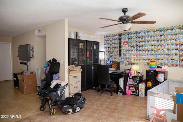 home office featuring light tile patterned floors, ceiling fan, and visible vents