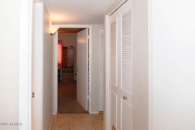 hallway with light tile patterned flooring