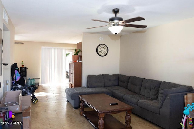 living room featuring light tile patterned floors, ceiling fan, and visible vents