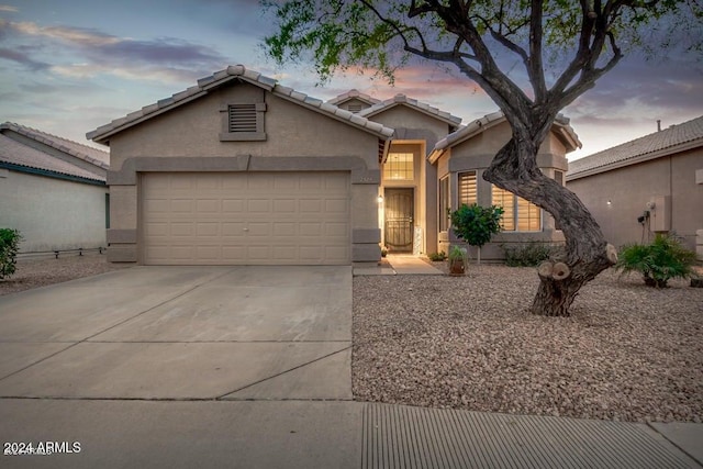 view of front of home with a garage