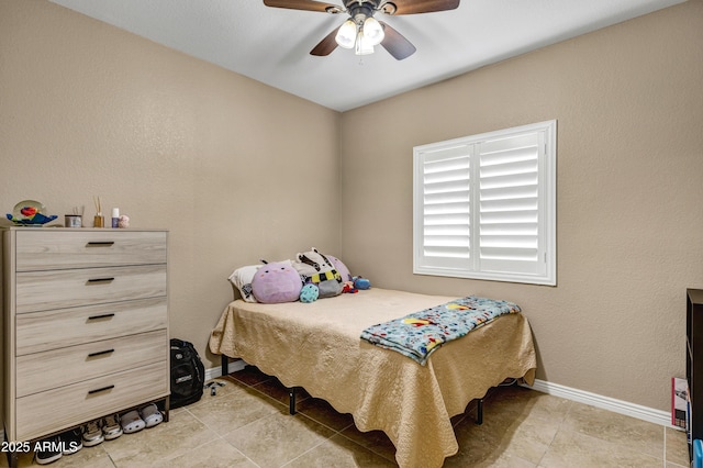 bedroom with light tile patterned floors and ceiling fan