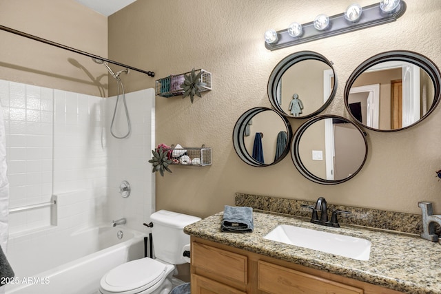 full bathroom featuring vanity,  shower combination, and toilet