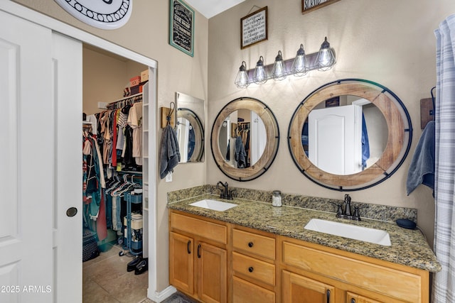 bathroom featuring tile patterned floors and vanity