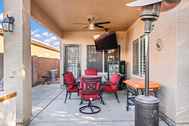 view of patio featuring ceiling fan