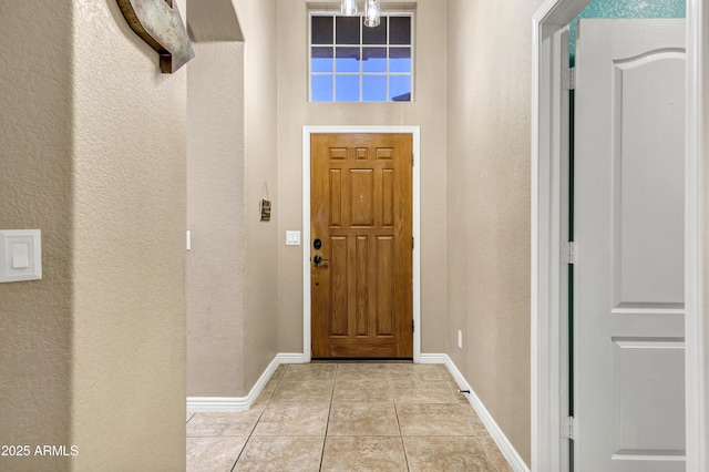 foyer featuring light tile patterned floors