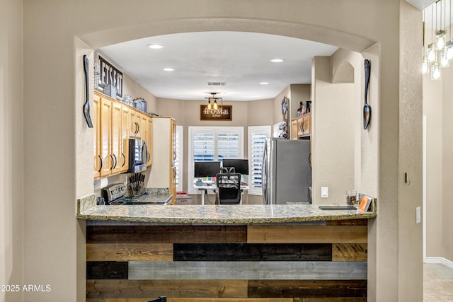 kitchen with light stone countertops, kitchen peninsula, stainless steel appliances, light tile patterned floors, and decorative light fixtures