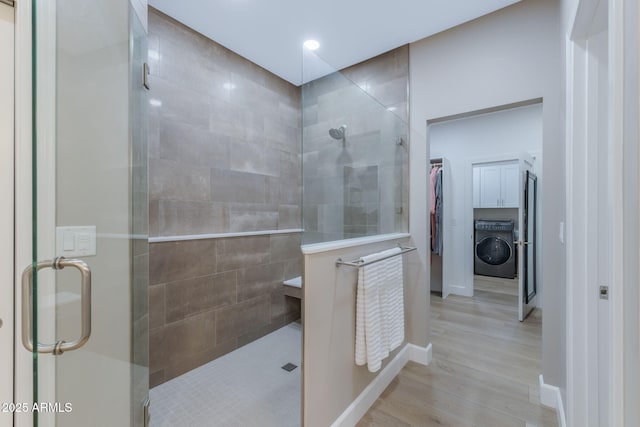 1002 W Rock Springs Cir, Payson, AZ 85541 - full bathroom featuring a tile shower, a spacious closet, and wood finished floors