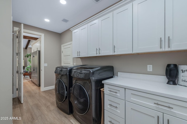 1002 W Rock Springs Cir, Payson, AZ 85541 - washroom featuring cabinet space, independent washer and dryer, light wood-type flooring, recessed lighting, and baseboards