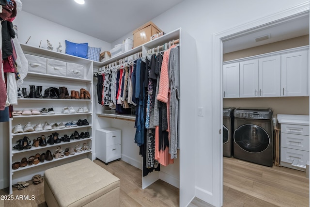 1002 W Rock Springs Cir, Payson, AZ 85541 - walk in closet featuring washing machine and dryer and light wood-type flooring