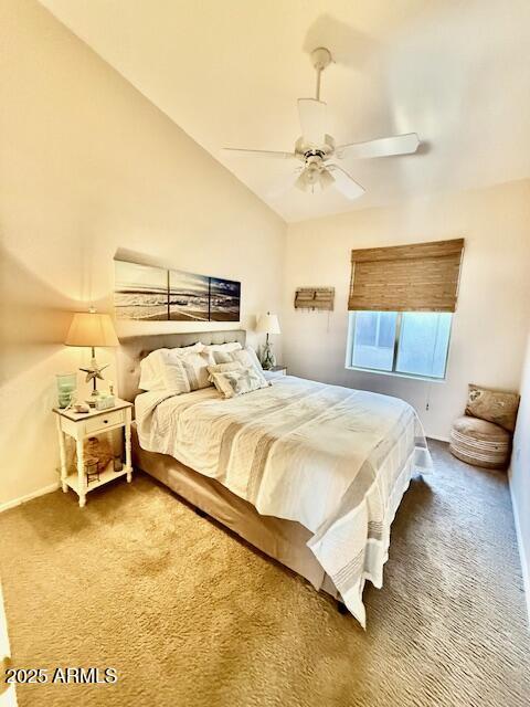 bedroom with lofted ceiling, baseboards, carpet floors, and ceiling fan