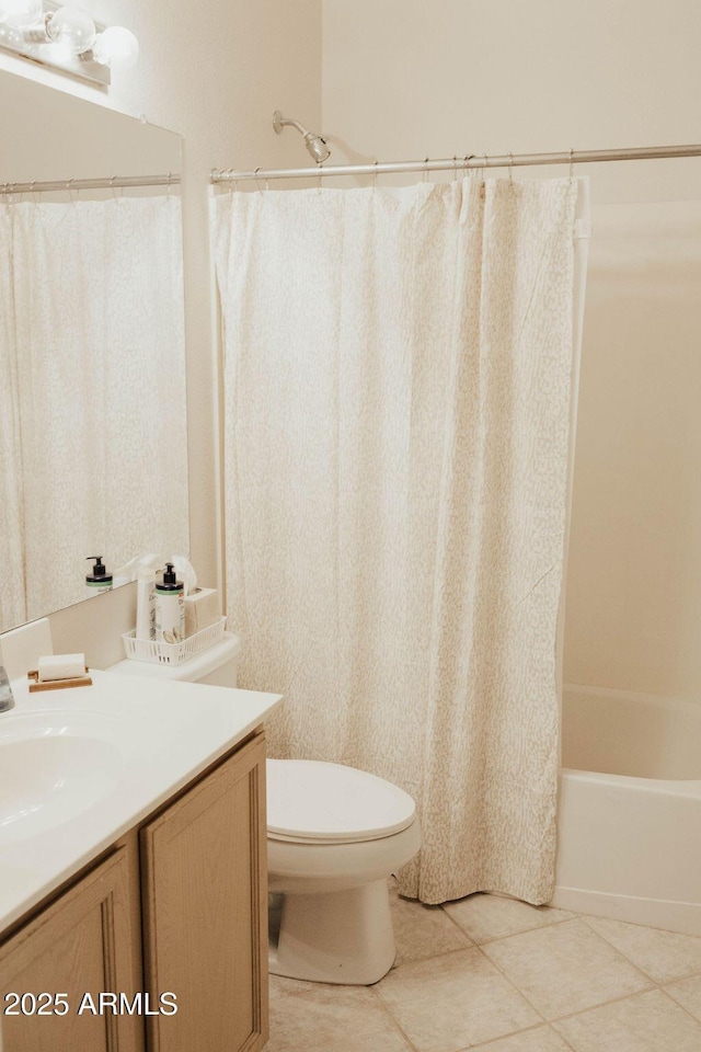 full bath featuring vanity, tile patterned floors, toilet, and shower / bathtub combination with curtain