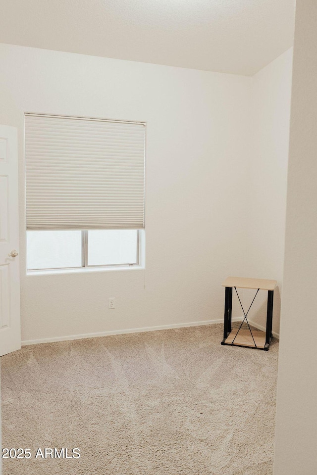 carpeted empty room featuring a healthy amount of sunlight