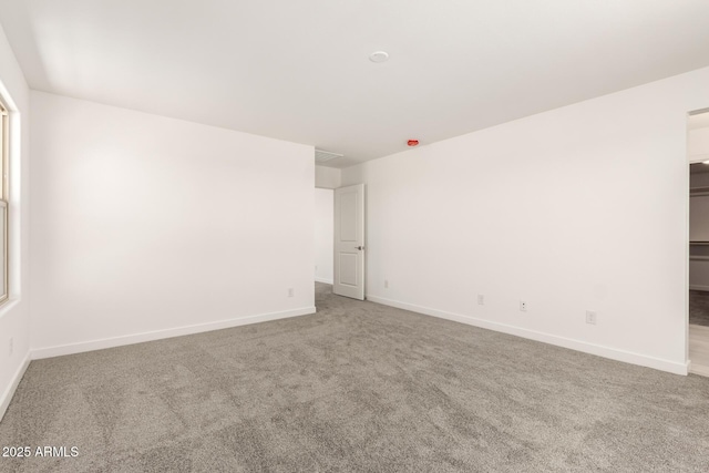 18189 W Hess St, Goodyear, AZ 85338 - empty room featuring carpet flooring and baseboards