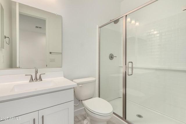 18189 W Hess St, Goodyear, AZ 85338 - full bathroom featuring vanity, a shower stall, toilet, and baseboards