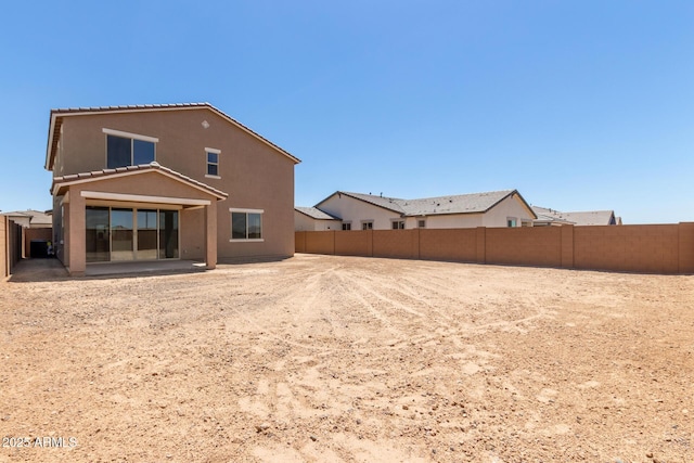 18189 W Hess St, Goodyear, AZ 85338 - back of house featuring a fenced backyard, stucco siding, and a patio area