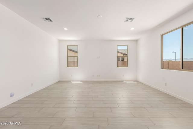 18189 W Hess St, Goodyear, AZ 85338 - unfurnished room featuring recessed lighting, baseboards, and light wood-style floors