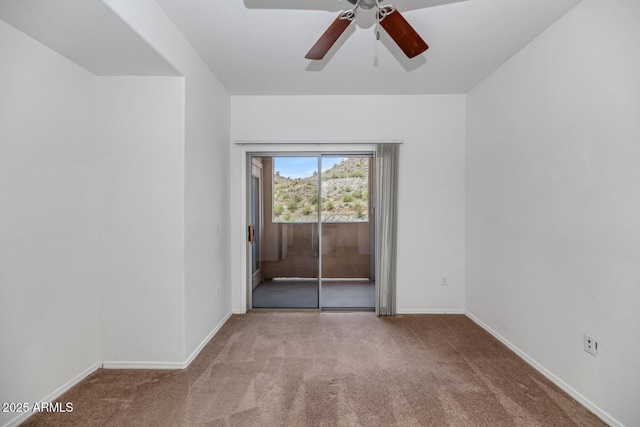 9820 N Central Ave Unit 303, Phoenix, AZ 85020 - unfurnished room with carpet floors, ceiling fan, and baseboards