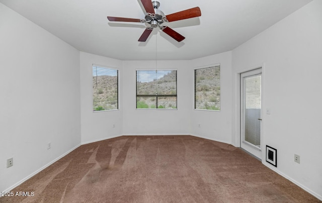 9820 N Central Ave Unit 303, Phoenix, AZ 85020 - spare room featuring carpet, ceiling fan, and baseboards