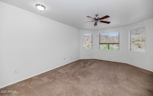 9820 N Central Ave Unit 303, Phoenix, AZ 85020 - carpeted empty room featuring ceiling fan and baseboards