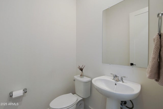 bathroom featuring sink and toilet