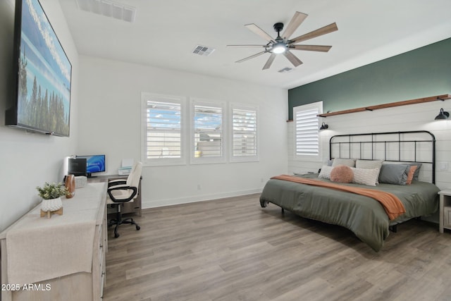 bedroom featuring ceiling fan and light wood-type flooring