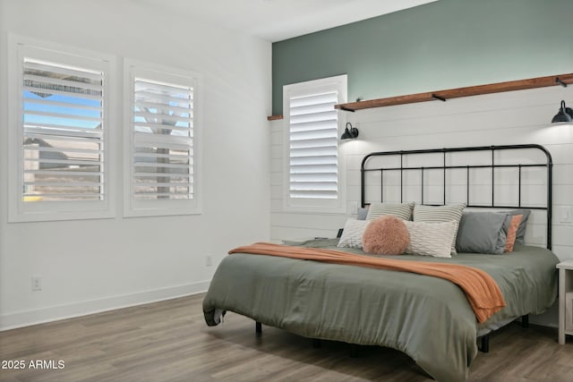 bedroom with hardwood / wood-style flooring