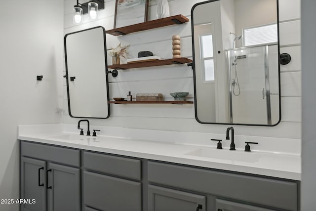 bathroom with walk in shower and vanity